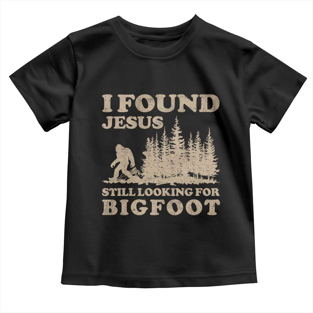 Retro I Found Jesus Still Looking Bigfoot Toddler T Shirt Vintage Sasquatch Believer Funny Christian Humor