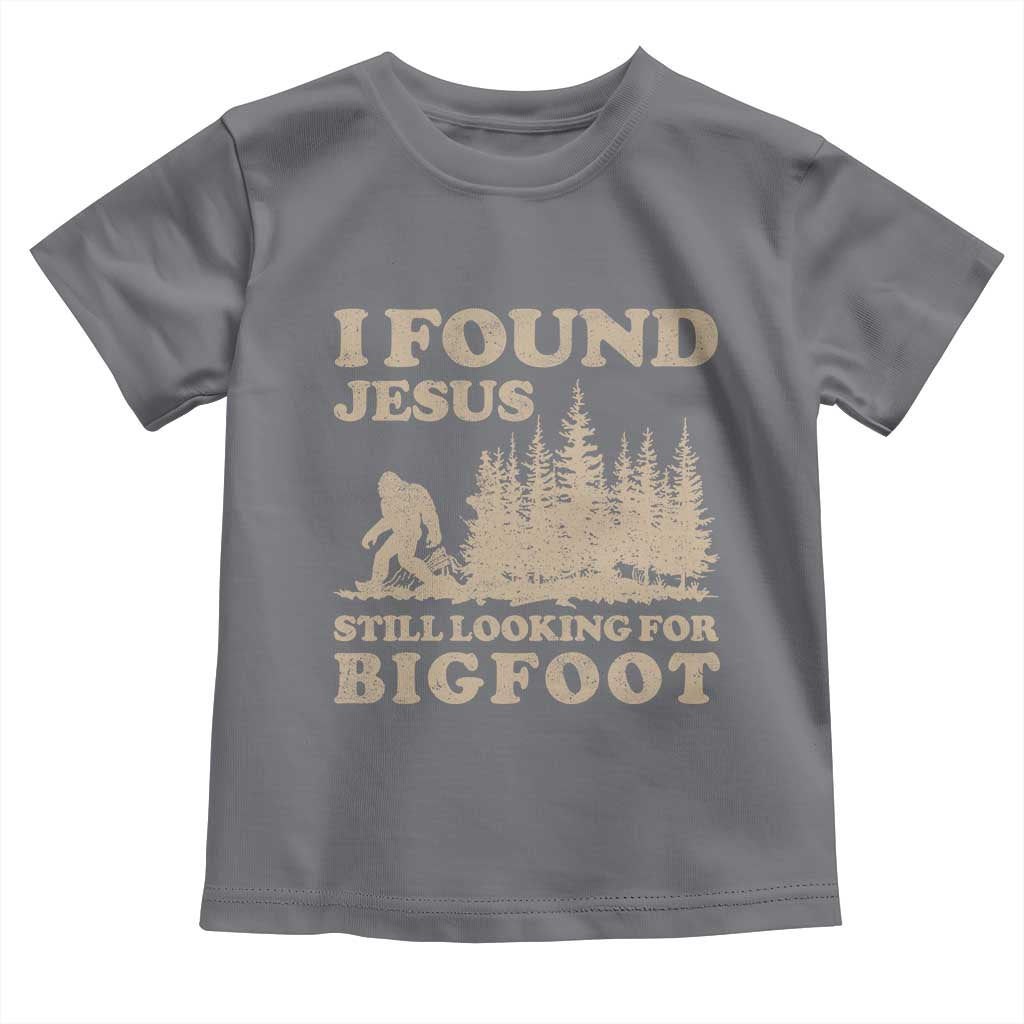 Retro I Found Jesus Still Looking Bigfoot Toddler T Shirt Vintage Sasquatch Believer Funny Christian Humor