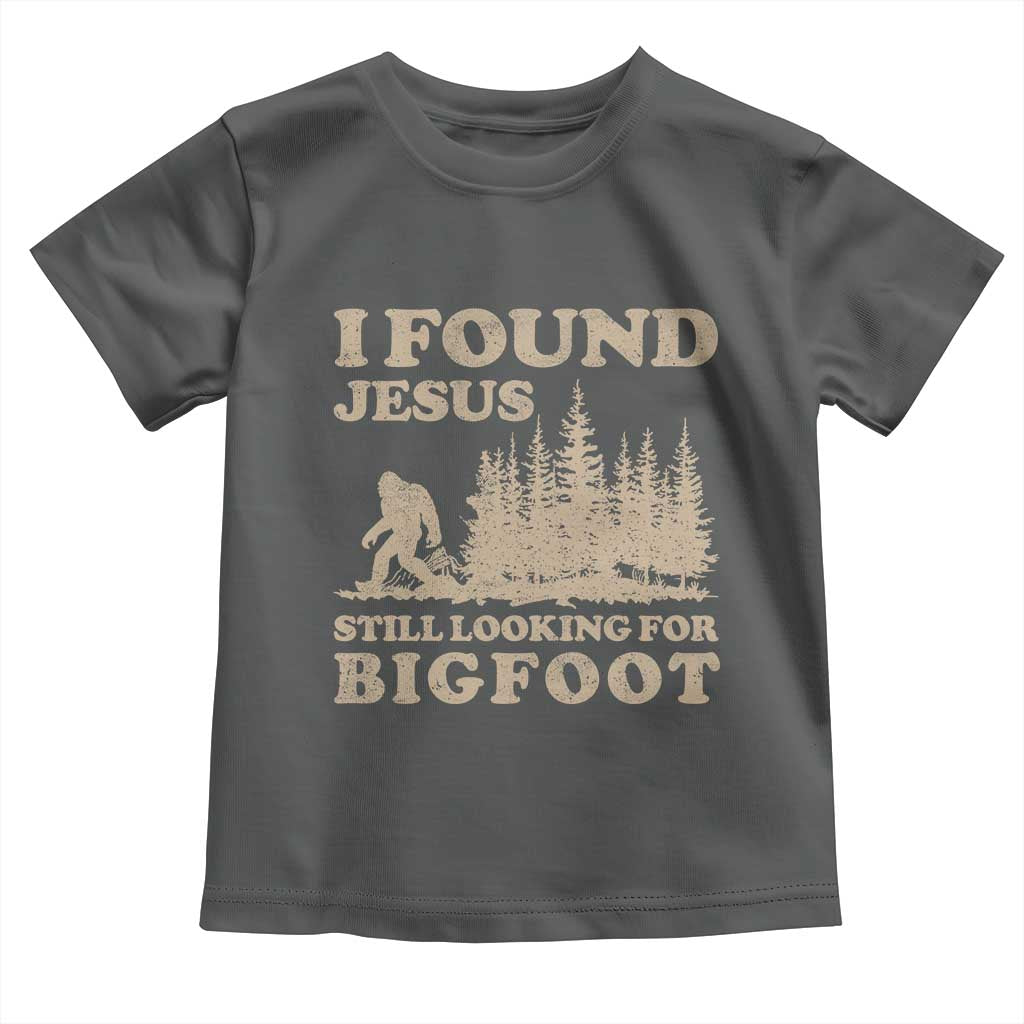 Retro I Found Jesus Still Looking Bigfoot Toddler T Shirt Vintage Sasquatch Believer Funny Christian Humor