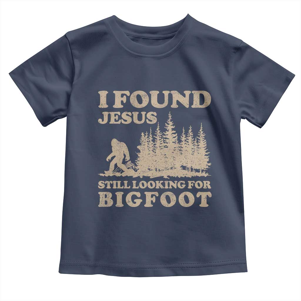 Retro I Found Jesus Still Looking Bigfoot Toddler T Shirt Vintage Sasquatch Believer Funny Christian Humor