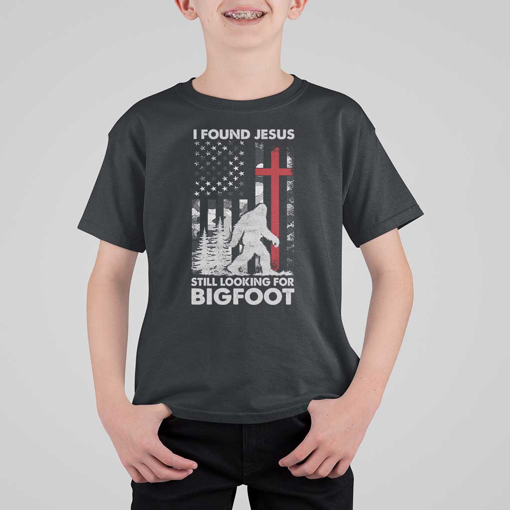 Retro I Found Jesus Still Looking For Bigfoot T Shirt For Kid Camouflage US American Flag Camo