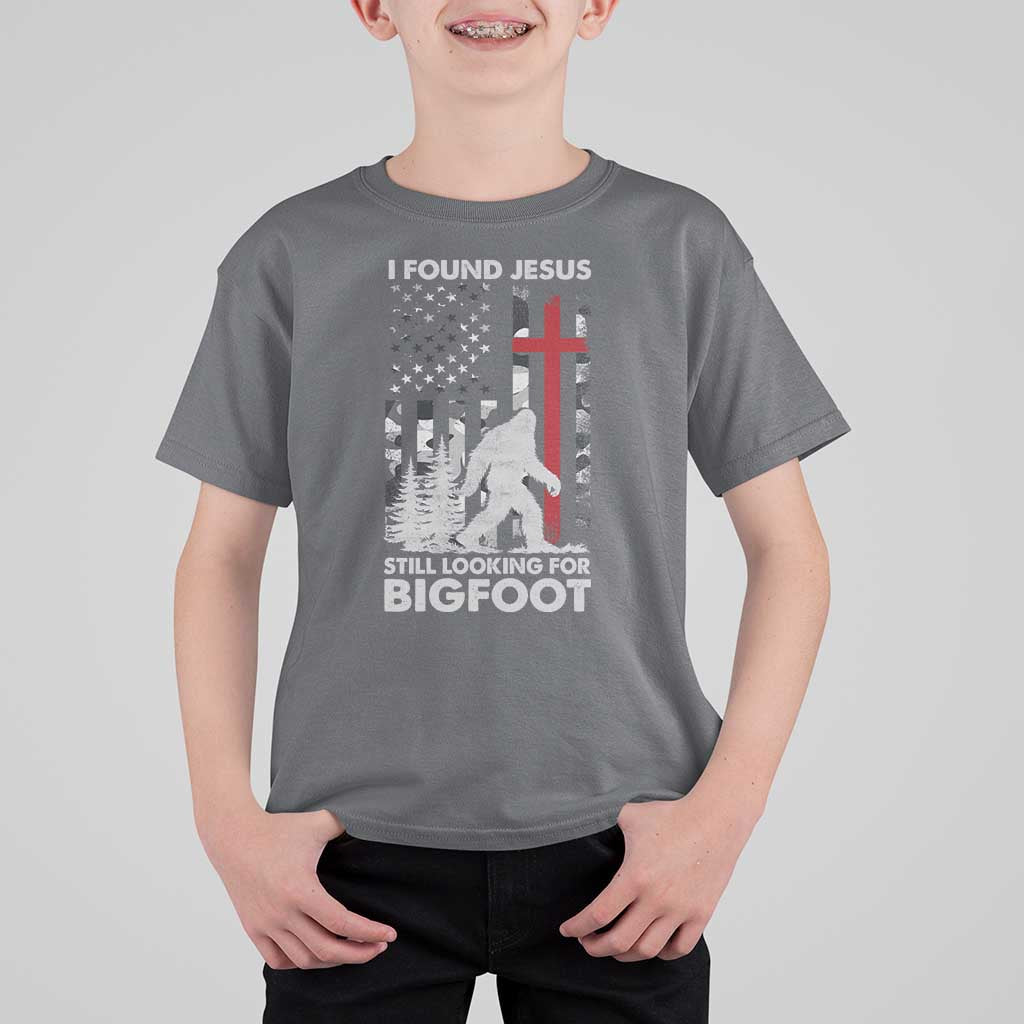 Retro I Found Jesus Still Looking For Bigfoot T Shirt For Kid Camouflage US American Flag Camo