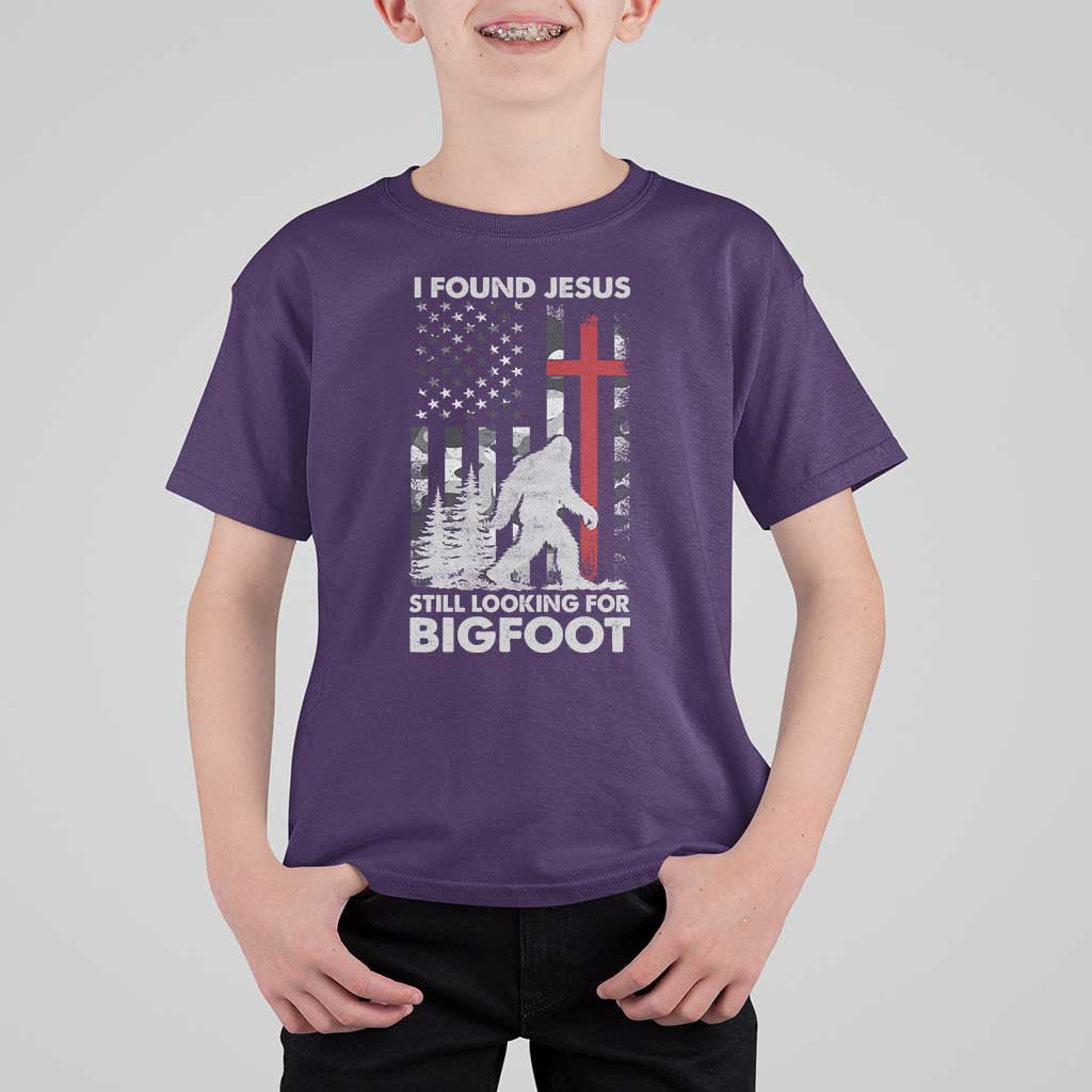 Retro I Found Jesus Still Looking For Bigfoot T Shirt For Kid Camouflage US American Flag Camo