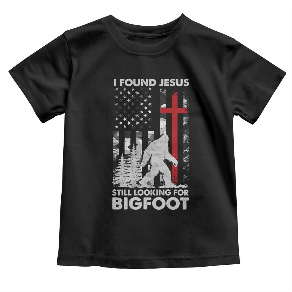 Retro I Found Jesus Still Looking For Bigfoot Toddler T Shirt Camouflage US American Flag Camo