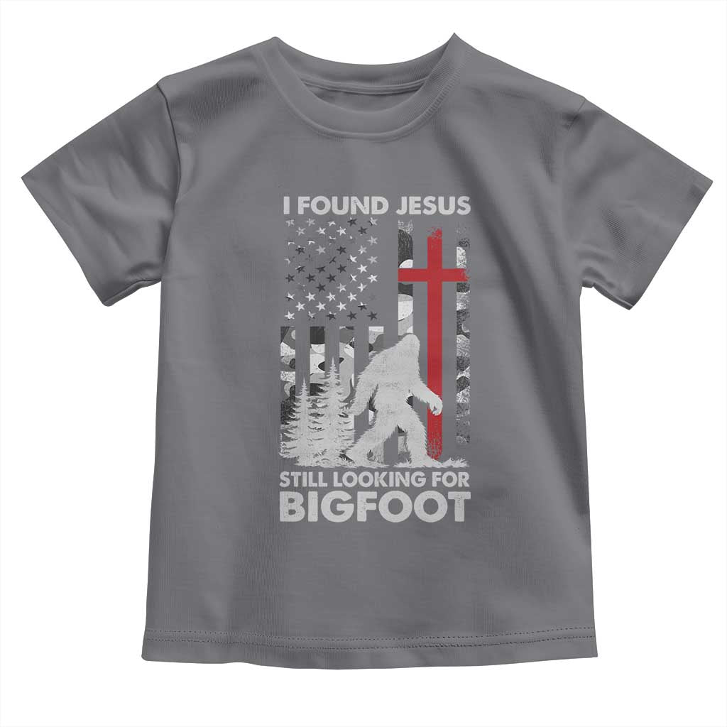Retro I Found Jesus Still Looking For Bigfoot Toddler T Shirt Camouflage US American Flag Camo