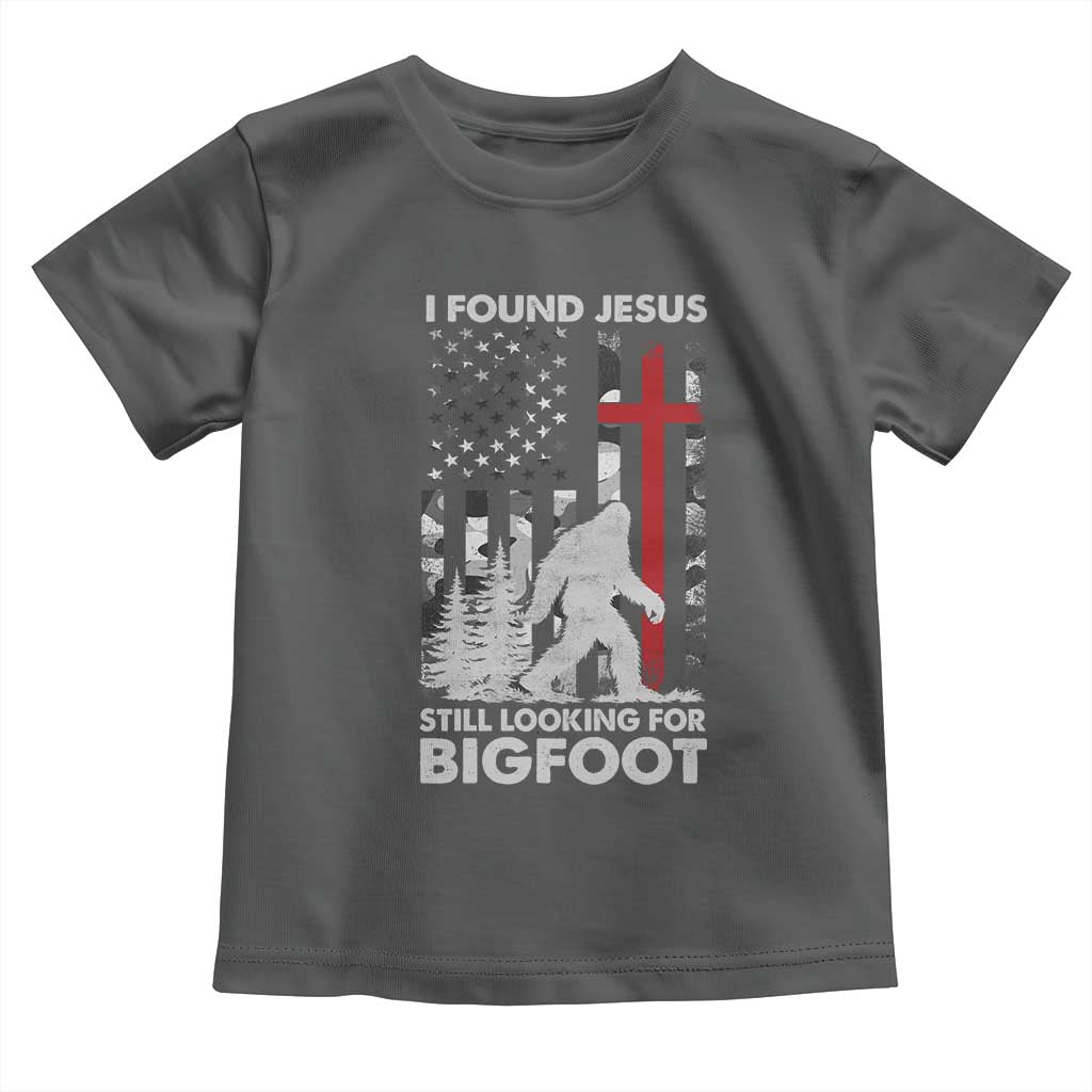 Retro I Found Jesus Still Looking For Bigfoot Toddler T Shirt Camouflage US American Flag Camo