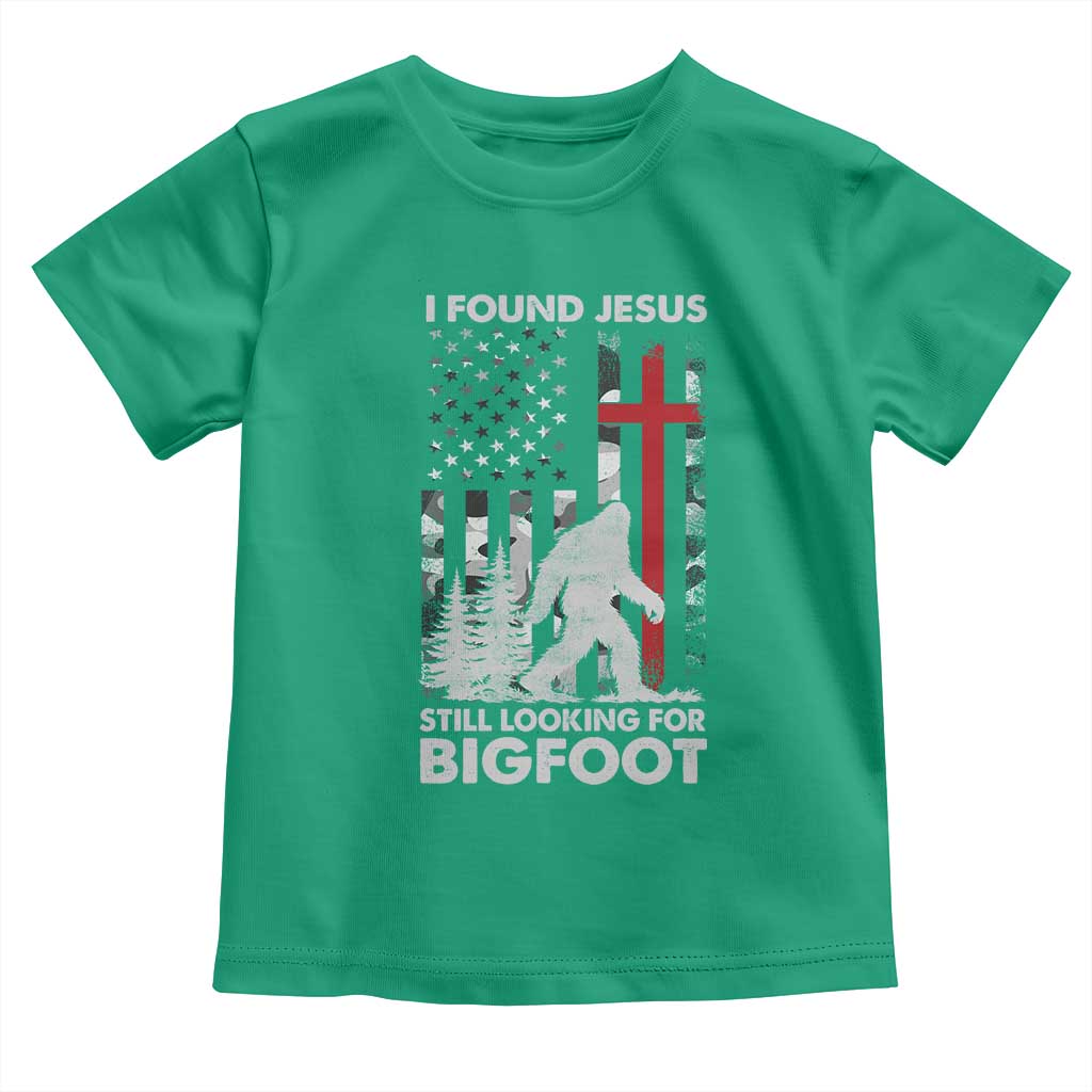 Retro I Found Jesus Still Looking For Bigfoot Toddler T Shirt Camouflage US American Flag Camo