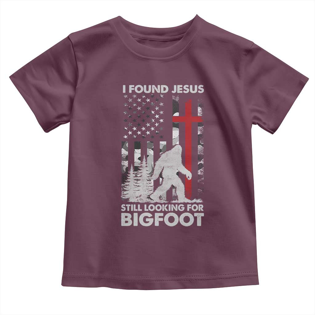 Retro I Found Jesus Still Looking For Bigfoot Toddler T Shirt Camouflage US American Flag Camo