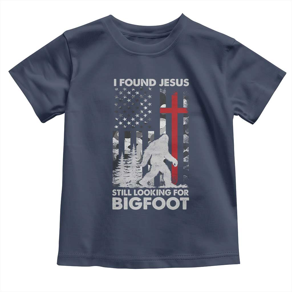 Retro I Found Jesus Still Looking For Bigfoot Toddler T Shirt Camouflage US American Flag Camo