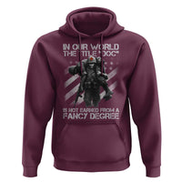 Combat Medic Hoodie In Our World The Title Doc Is Not Earned Form A Fancy Degree - Wonder Print Shop