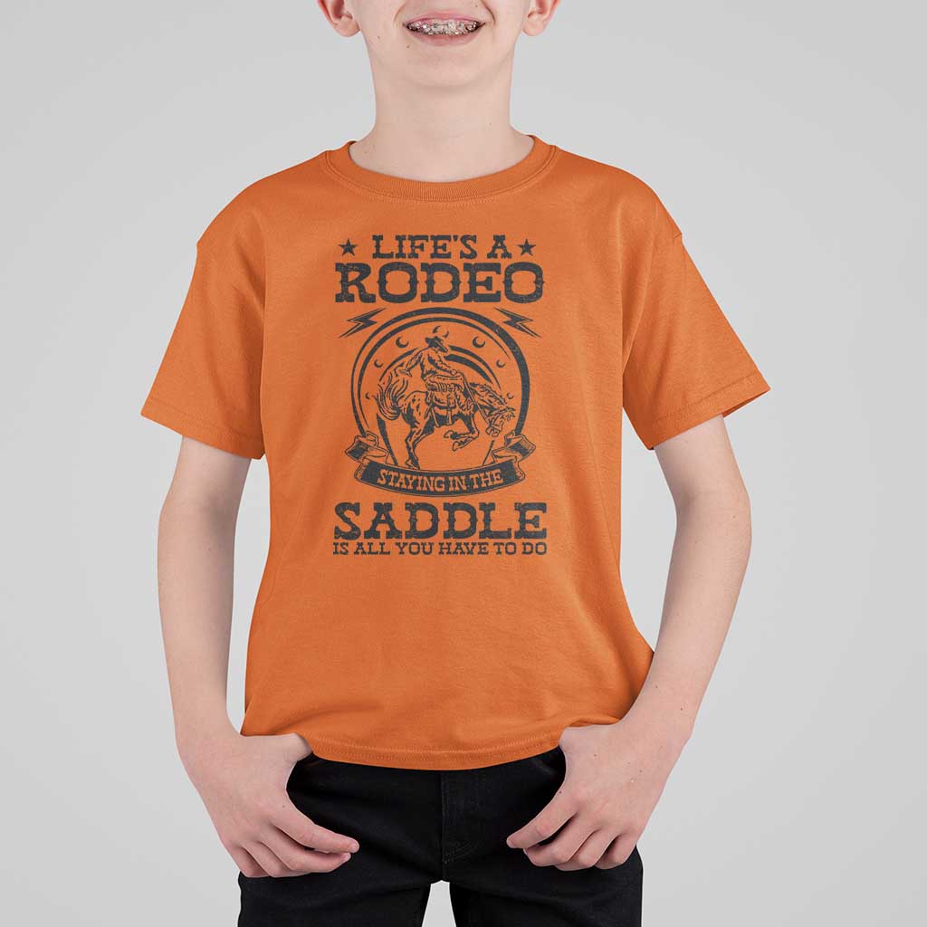 Western Cowboy T Shirt For Kid Life's A Rodeo Staying In The Saddle Is All You Have To Do - Wonder Print Shop