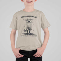 Funny God Is Testing Me And I Have Not Studied T Shirt For Kid Cowboy Racoon