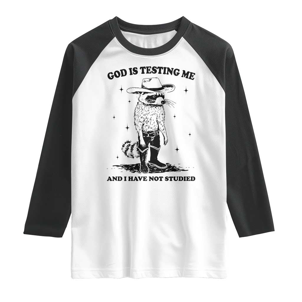 Funny God Is Testing Me And I Have Not Studied Raglan Shirt Cowboy Racoon