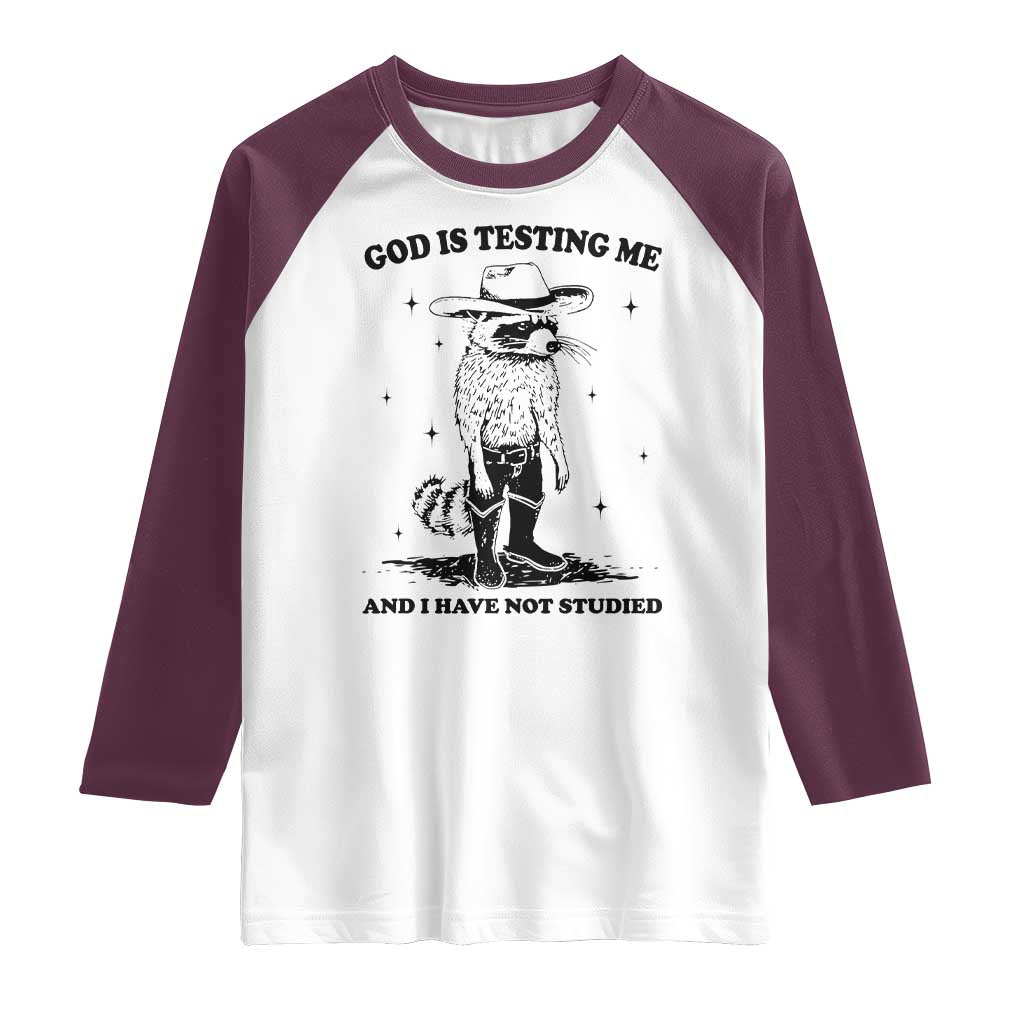 Funny God Is Testing Me And I Have Not Studied Raglan Shirt Cowboy Racoon