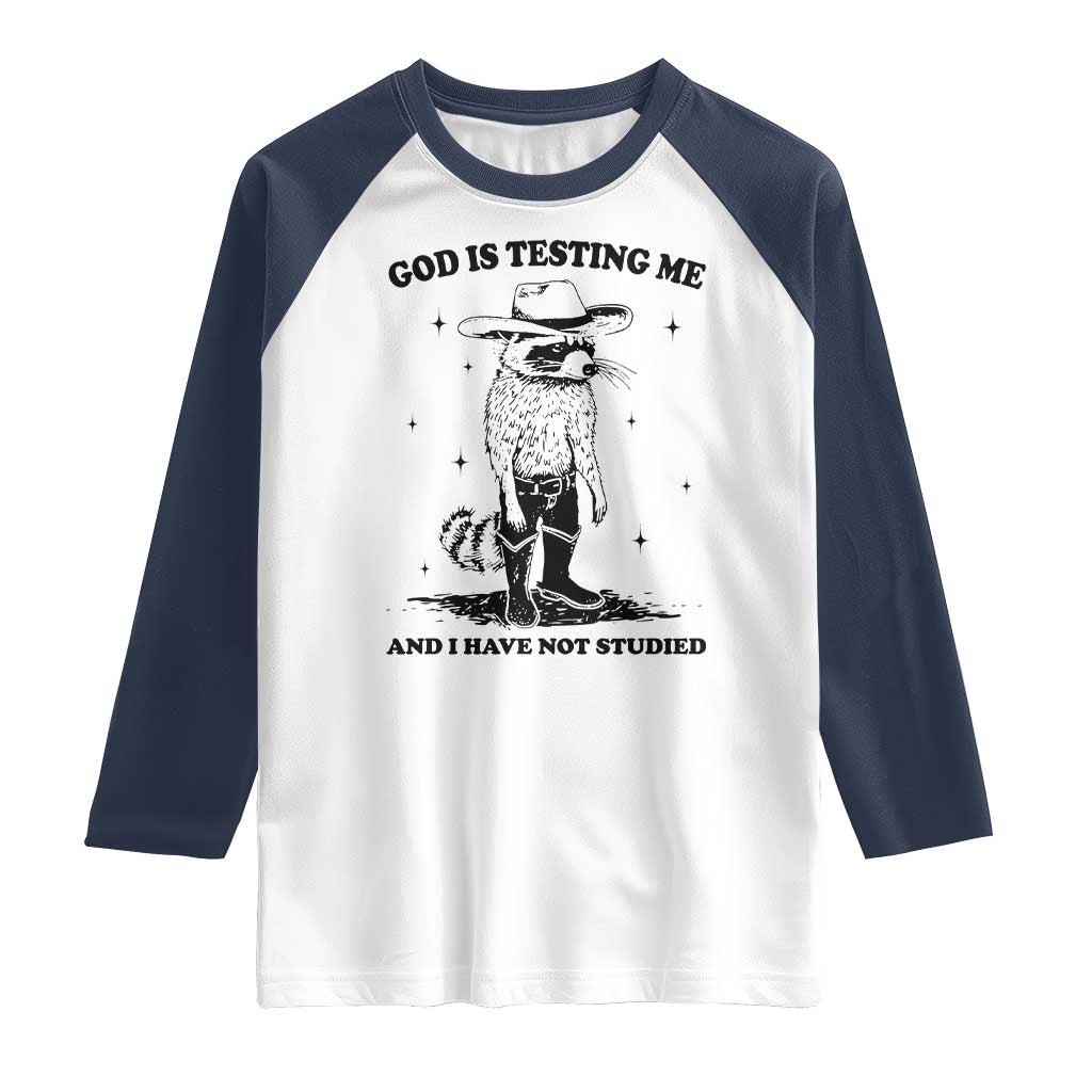 Funny God Is Testing Me And I Have Not Studied Raglan Shirt Cowboy Racoon