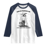 Funny God Is Testing Me And I Have Not Studied Raglan Shirt Cowboy Racoon