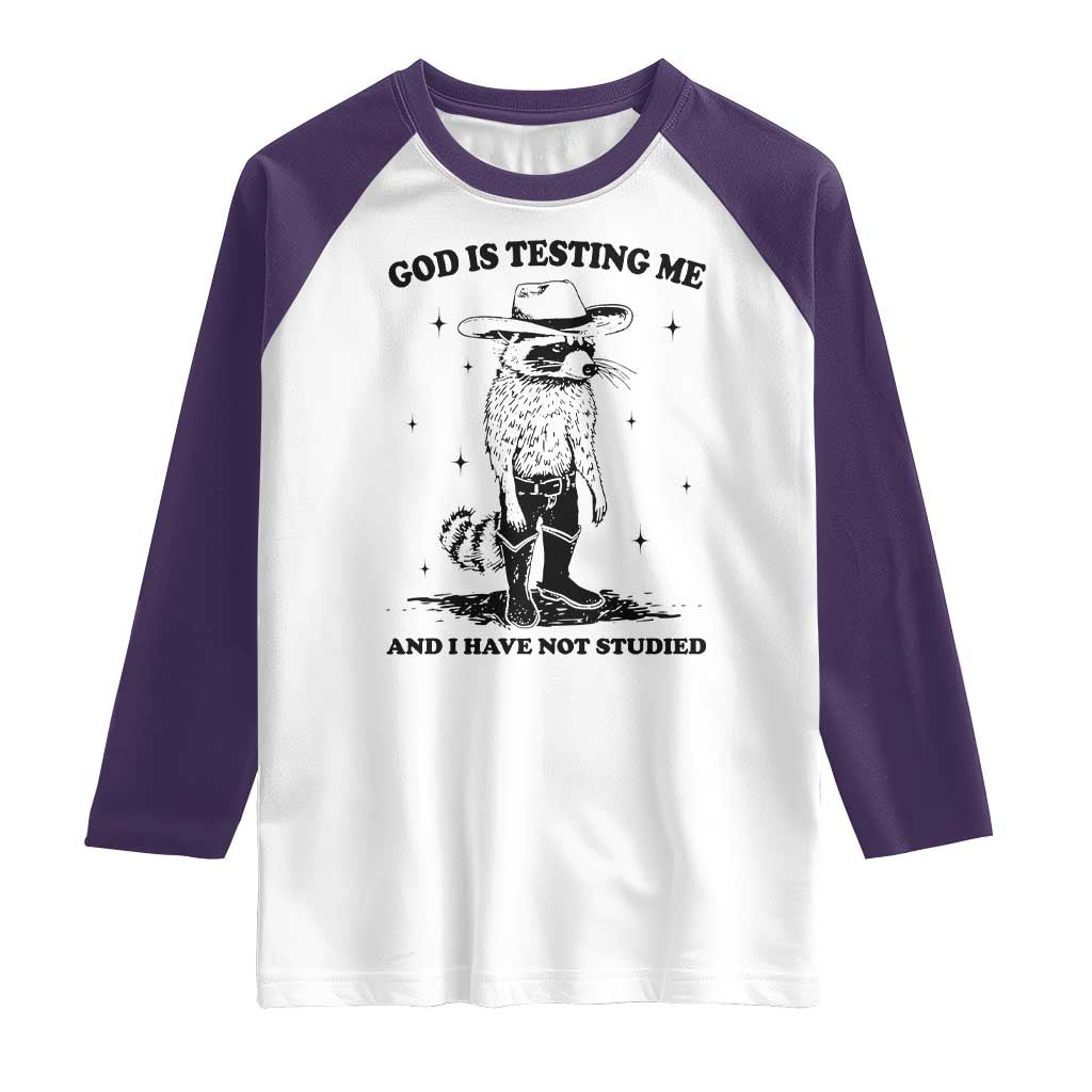 Funny God Is Testing Me And I Have Not Studied Raglan Shirt Cowboy Racoon