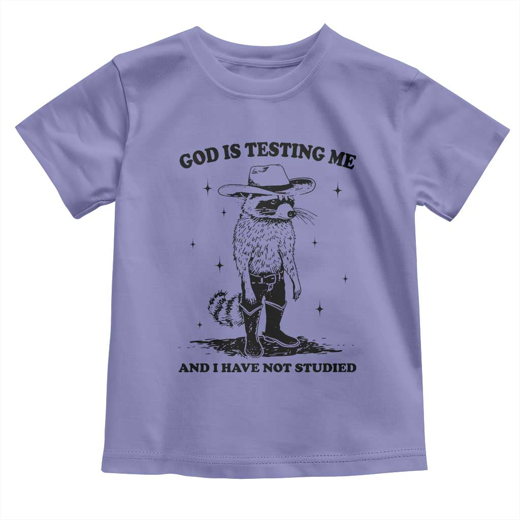 Funny God Is Testing Me And I Have Not Studied Toddler T Shirt Cowboy Racoon
