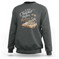 A New Chapter Begins Retired 2026 Sweatshirt Retired Teacher Floral Book - Wonder Print Shop