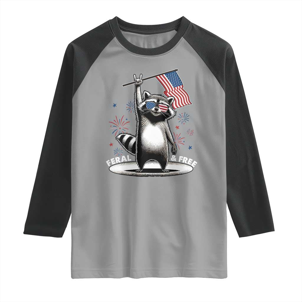Funny Feral And Free Raglan Shirt 4th of July Patriotic Raccoon With American Flag Fireworks - Wonder Print Shop
