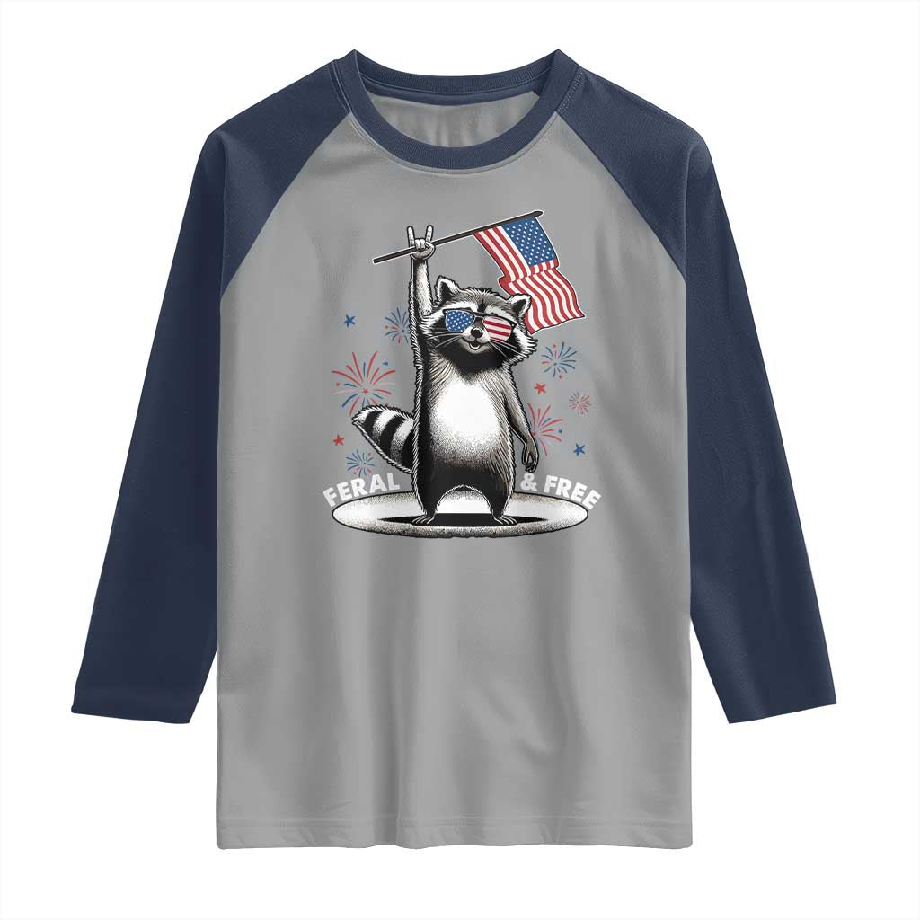 Funny Feral And Free Raglan Shirt 4th of July Patriotic Raccoon With American Flag Fireworks - Wonder Print Shop