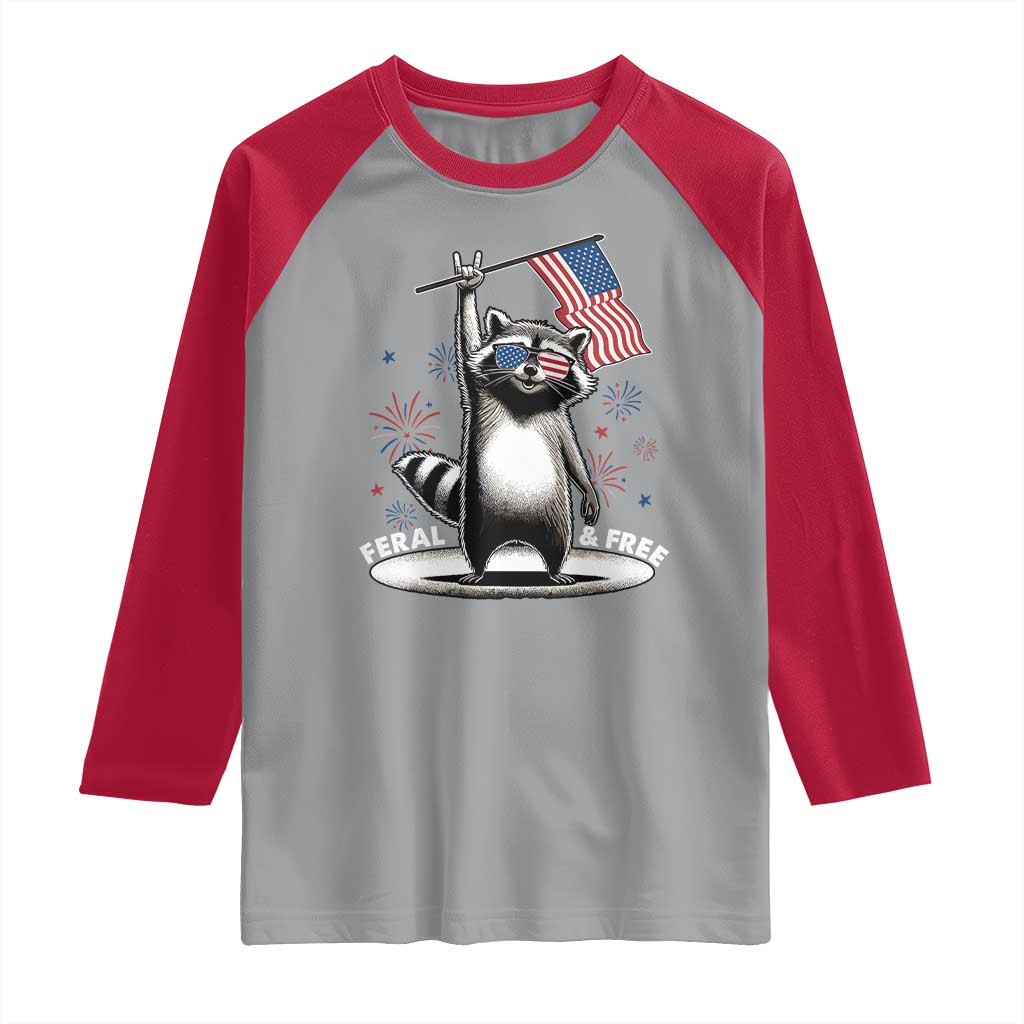 Funny Feral And Free Raglan Shirt 4th of July Patriotic Raccoon With American Flag Fireworks - Wonder Print Shop