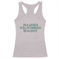In A World Full Of Darkness Be A Light Racerback Tank Top Christmas Quote Gift - Wonder Print Shop