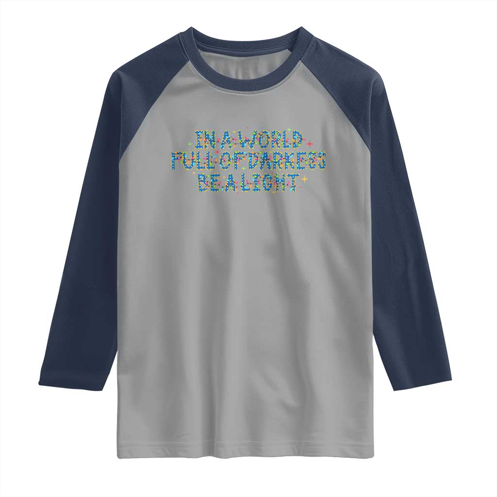 In A World Full Of Darkness Be A Light Raglan Shirt Christmas Quote Gift - Wonder Print Shop