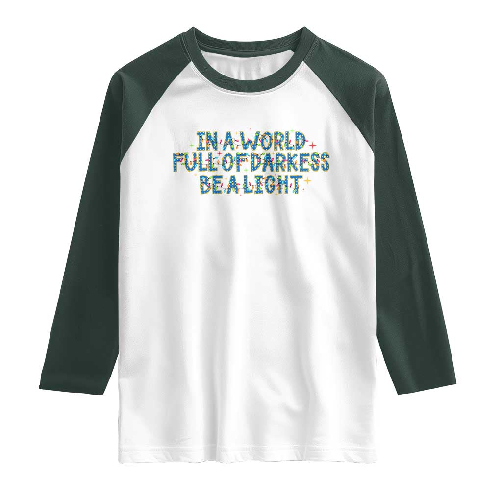 In A World Full Of Darkness Be A Light Raglan Shirt Christmas Quote Gift - Wonder Print Shop