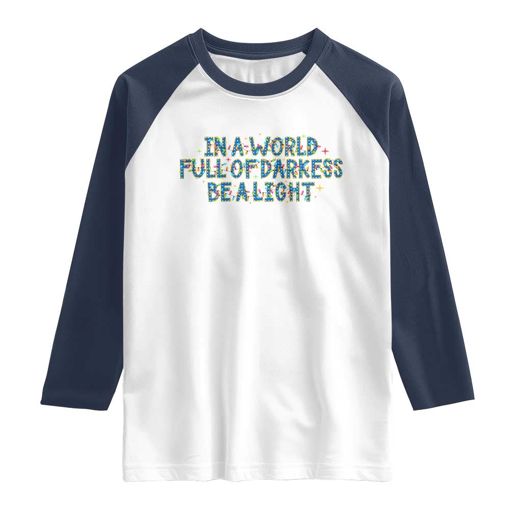 In A World Full Of Darkness Be A Light Raglan Shirt Christmas Quote Gift - Wonder Print Shop
