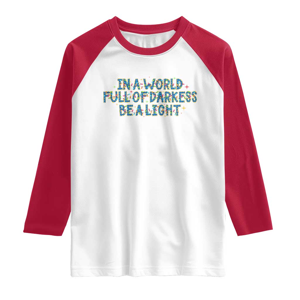 In A World Full Of Darkness Be A Light Raglan Shirt Christmas Quote Gift - Wonder Print Shop