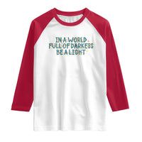 In A World Full Of Darkness Be A Light Raglan Shirt Christmas Quote Gift - Wonder Print Shop