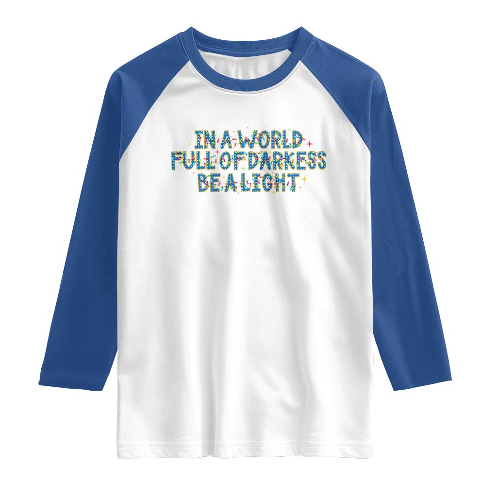 In A World Full Of Darkness Be A Light Raglan Shirt Christmas Quote Gift - Wonder Print Shop