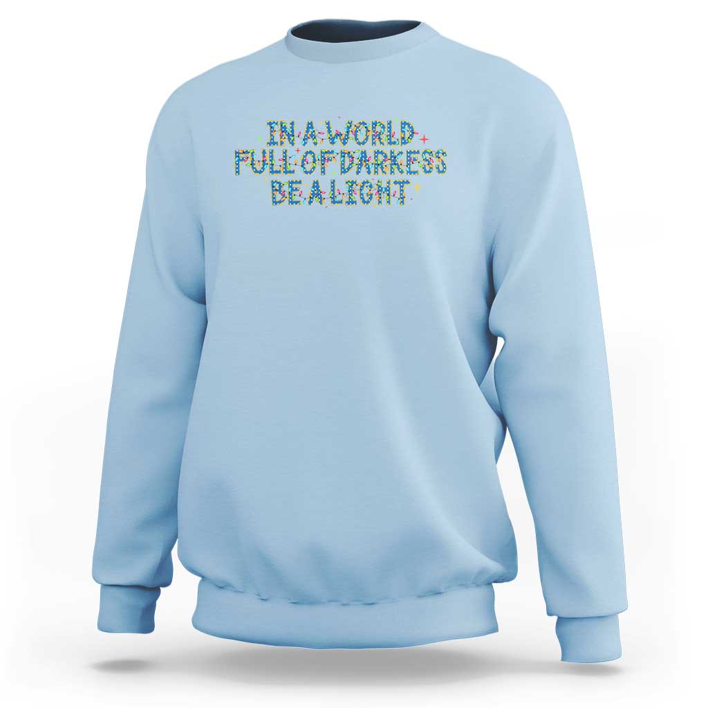 In A World Full Of Darkness Be A Light Sweatshirt Christmas Quote Gift - Wonder Print Shop