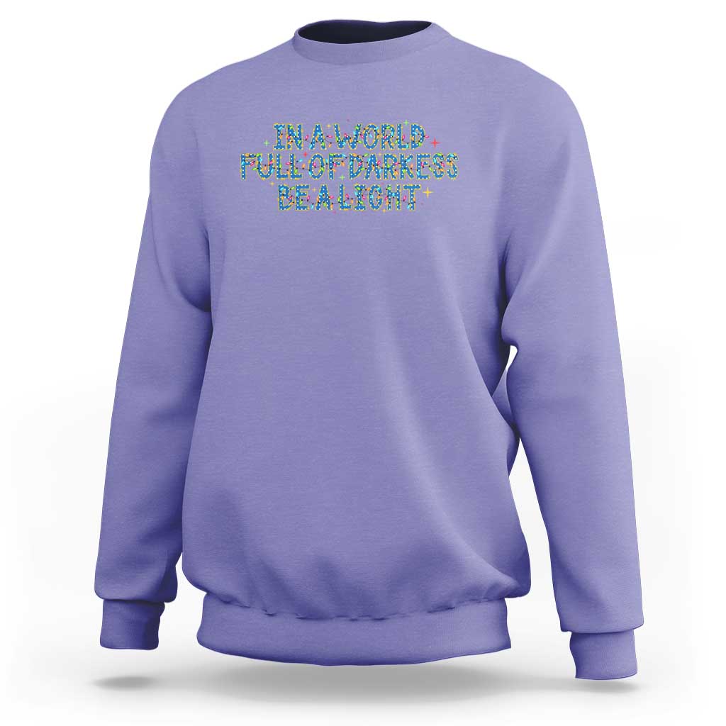 In A World Full Of Darkness Be A Light Sweatshirt Christmas Quote Gift - Wonder Print Shop