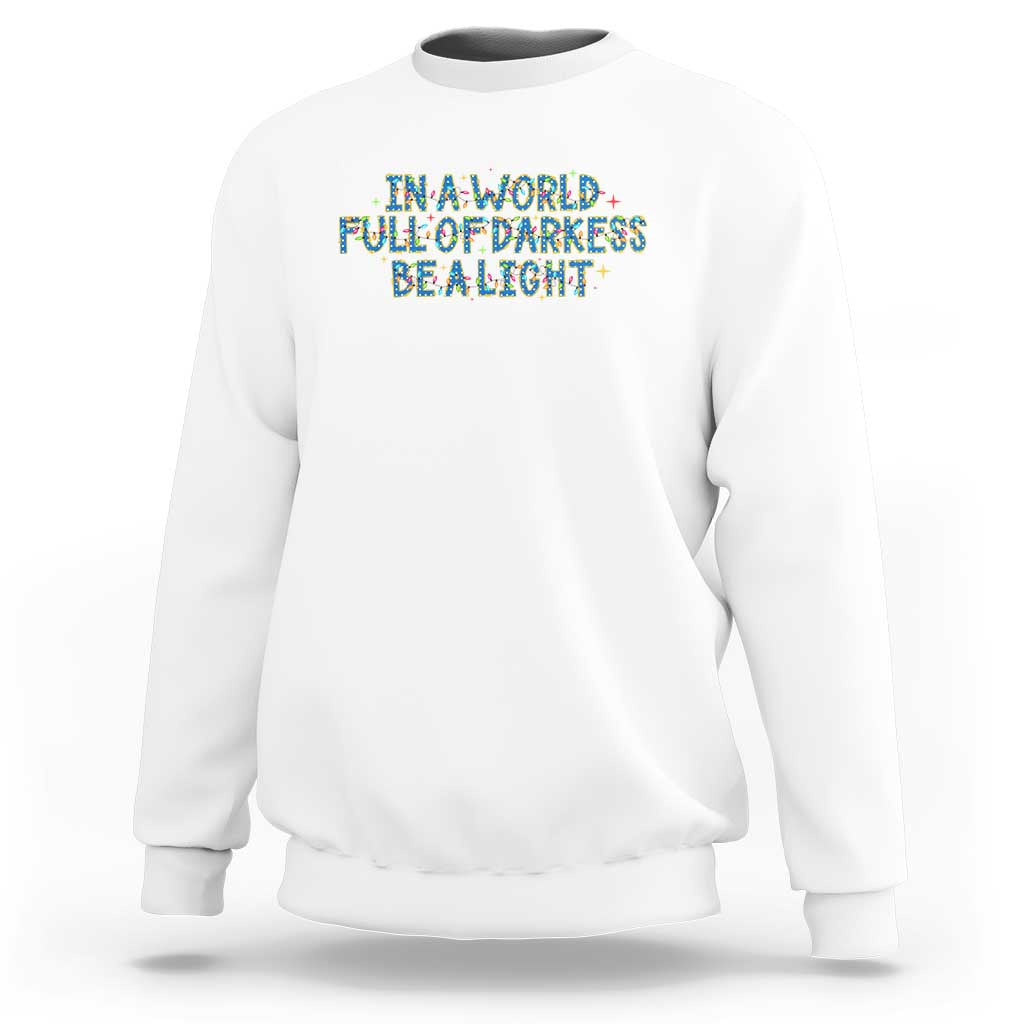 In A World Full Of Darkness Be A Light Sweatshirt Christmas Quote Gift - Wonder Print Shop