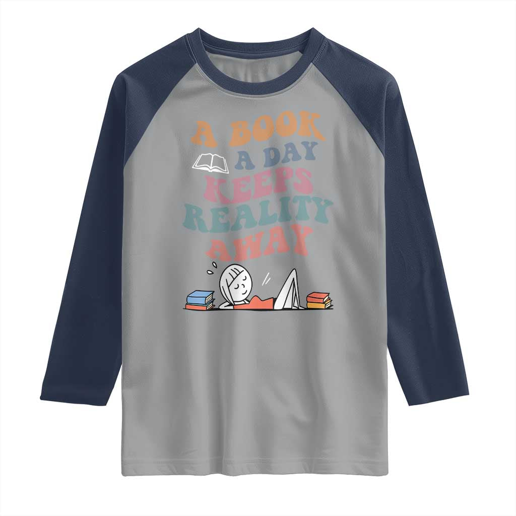 A Book A Day Keeps Reality Away Raglan Shirt Cute Girl Book Lover - Wonder Print Shop