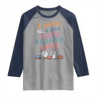 A Book A Day Keeps Reality Away Raglan Shirt Cute Girl Book Lover - Wonder Print Shop
