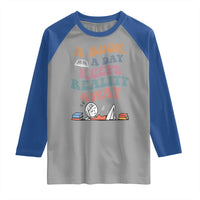 A Book A Day Keeps Reality Away Raglan Shirt Cute Girl Book Lover - Wonder Print Shop