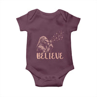 Funny Bigfoot Blowing Dandelion Flower Graphic Baby Onesie Believe Endometrial Cancer Awareness