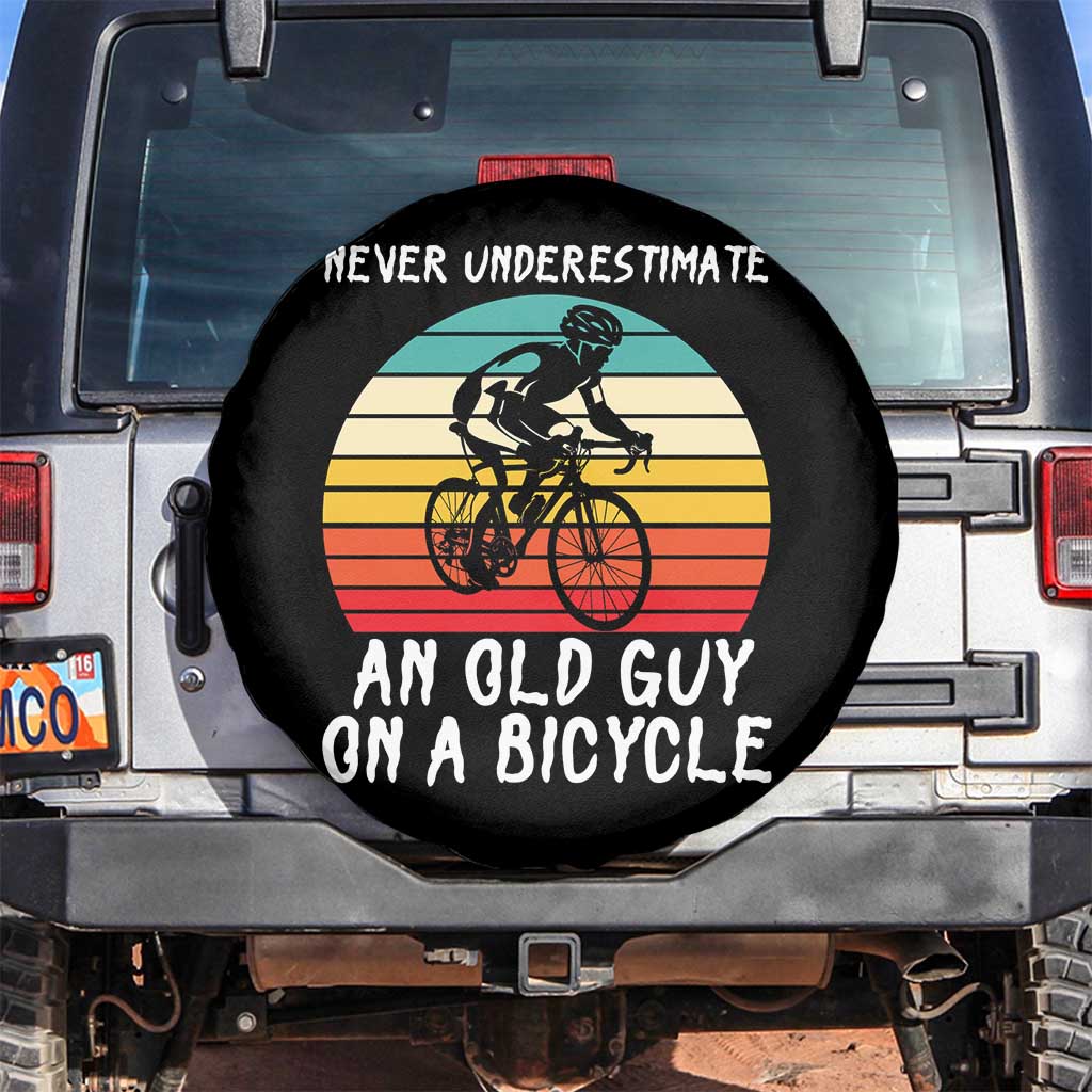 Never Underestimate An Old Guy On A Bicycle Spare Tire Cover Cycling Lover Gift