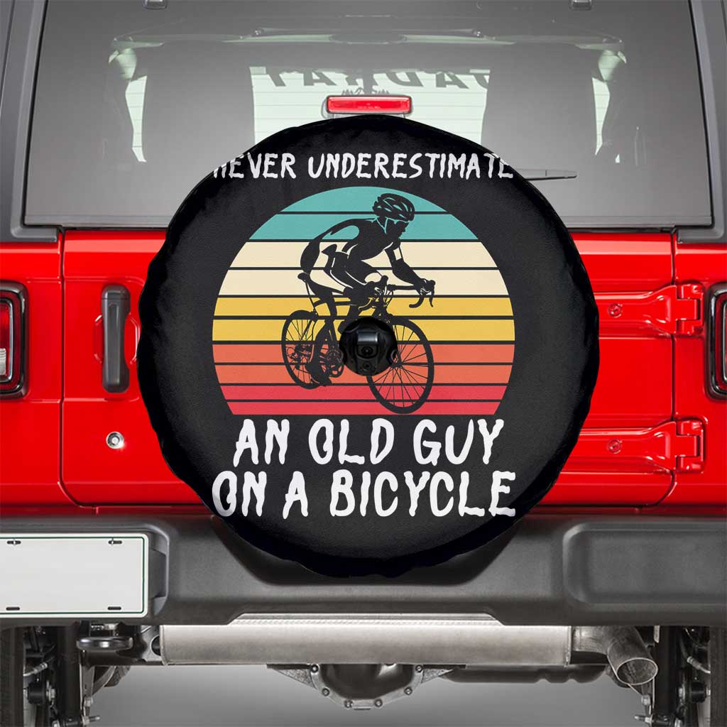 Never Underestimate An Old Guy On A Bicycle Spare Tire Cover Cycling Lover Gift