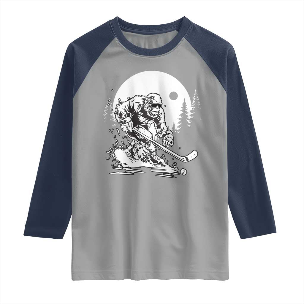 Bigfoot Playing Ice Hockey Raglan Shirt Funny Cryptid Sports Gift - Wonder Print Shop