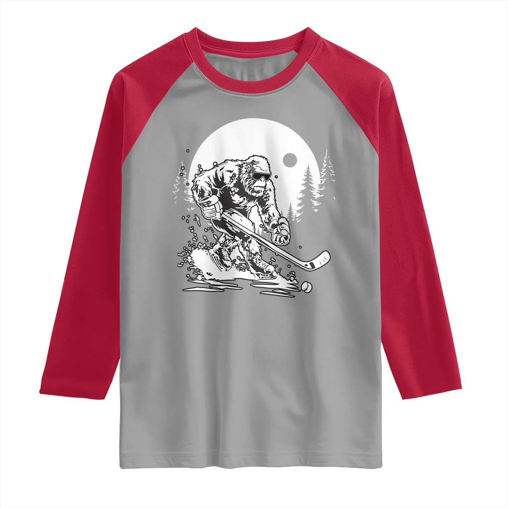 Bigfoot Playing Ice Hockey Raglan Shirt Funny Cryptid Sports Gift - Wonder Print Shop