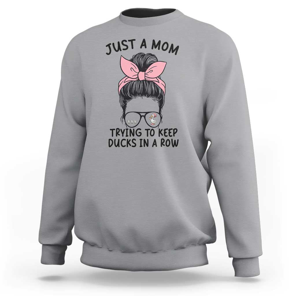Just A Mom Trying To Keep Her Ducks In A Row Sweatshirt Funny Duck Mom Messy Hair Bun Moms Life