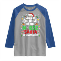Christmas Nurse Raglan Shirt Be Nice To The Nurse Santa Is Watching - Wonder Print Shop