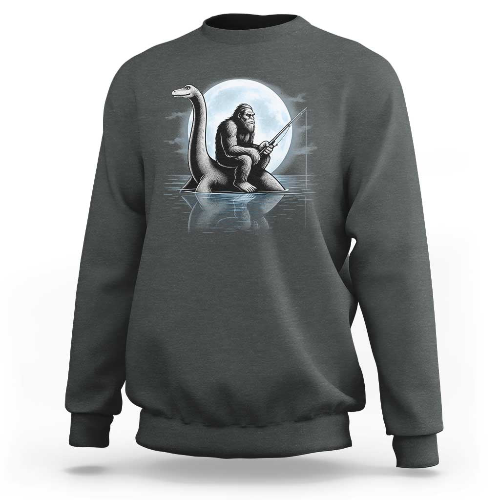 Funny Bigfoot Fishing Sweatshirt Sasquatch Riding Nessie Cryptid Moon Night - Wonder Print Shop