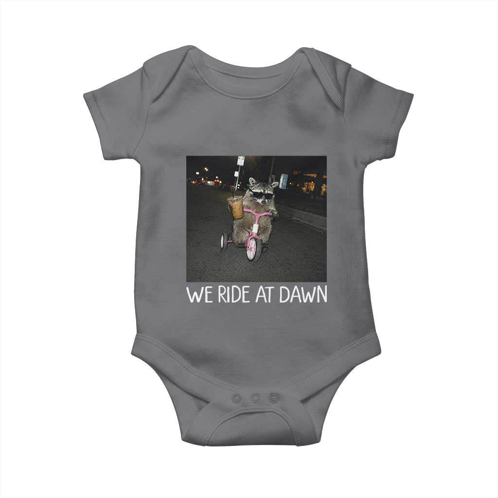 We Ride at Dawn Baby Onesie Funny Racoon Riding Tricycle Chaotic Meme