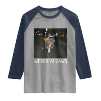 We Ride at Dawn Raglan Shirt Funny Racoon Riding Tricycle Chaotic Meme