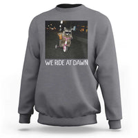 We Ride at Dawn Sweatshirt Funny Racoon Riding Tricycle Chaotic Meme